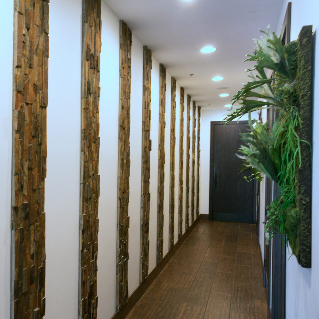 Spa hallway corridor with wood columns and plants