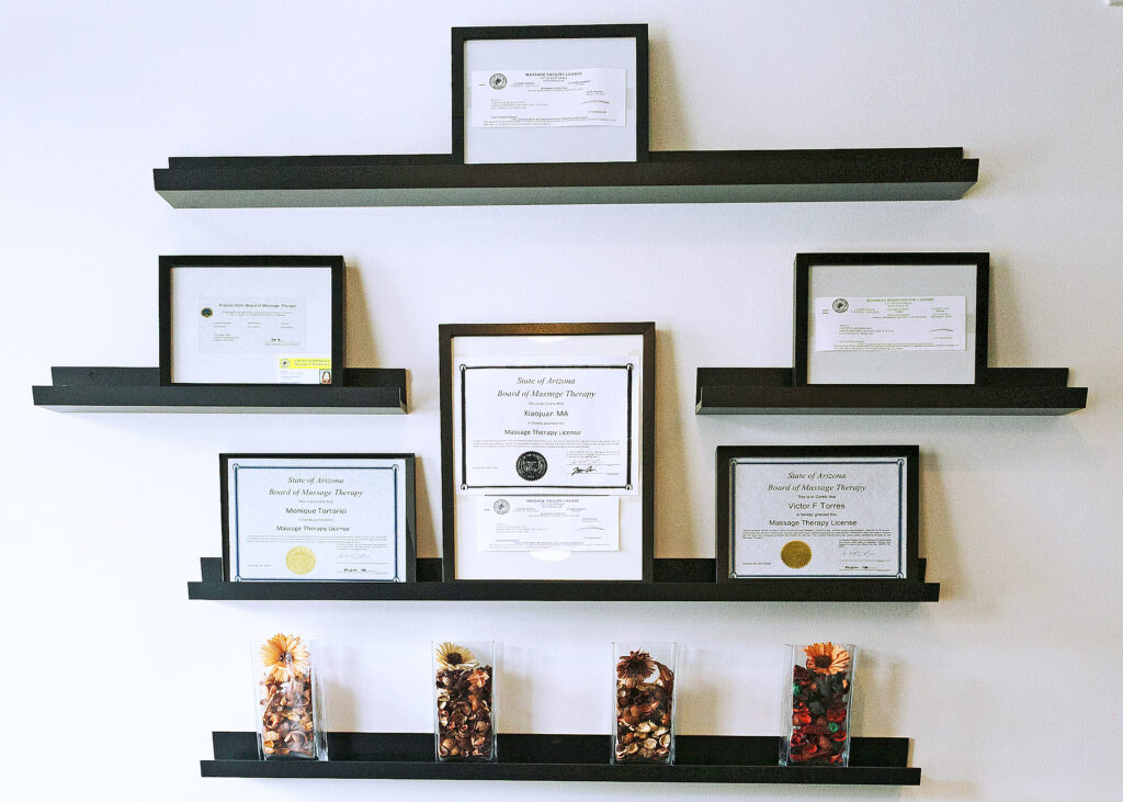 Certificates and awards displayed on shelves