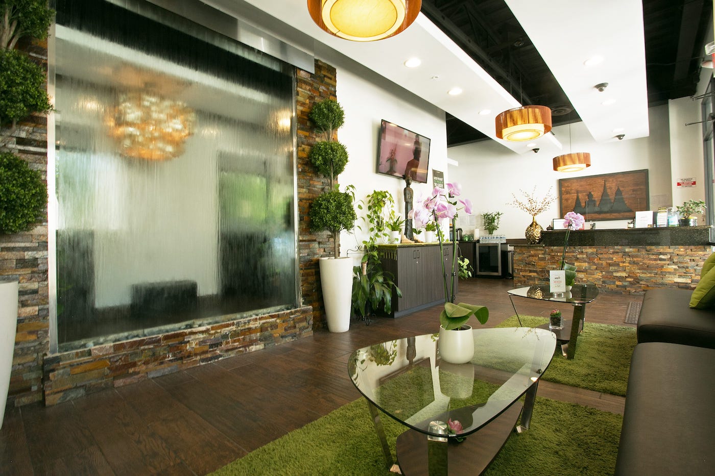 Thai Royal Massage & Spa reception area with waterfall feature and elegant decor
